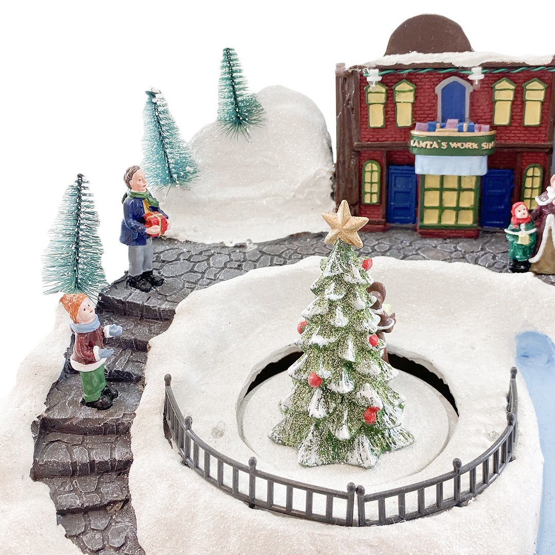 Village de Noel enneigé Carrousel Lumières Sons Mouvement 37x21x27cm