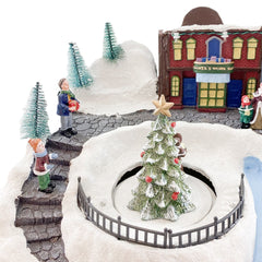 Village de Noel enneigé Carrousel Lumières Sons Mouvement 37x21x27cm