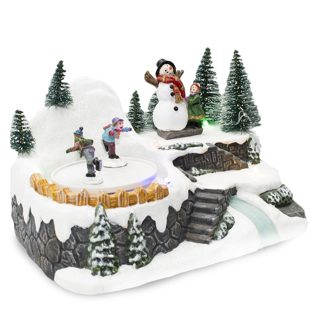361004 Carrousel village Noël avec piste lumineuse mouvement musical 18x13x16cm