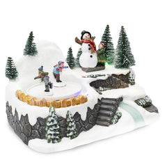 361004 Carrousel village Noël avec piste lumineuse mouvement musical 18x13x16cm