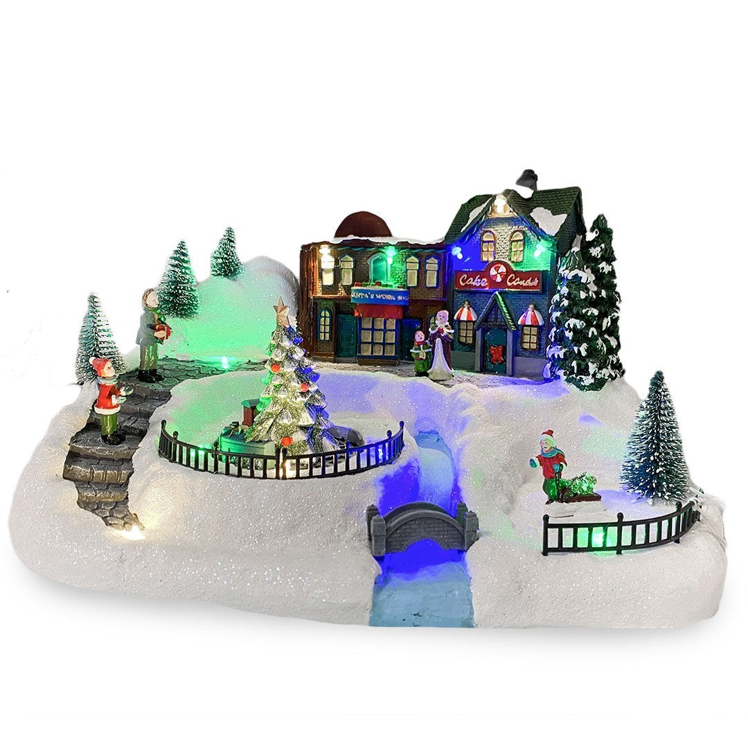 361039 Carousel Christmas Village Snow, Lights, Sounds and Movement 37x21x27