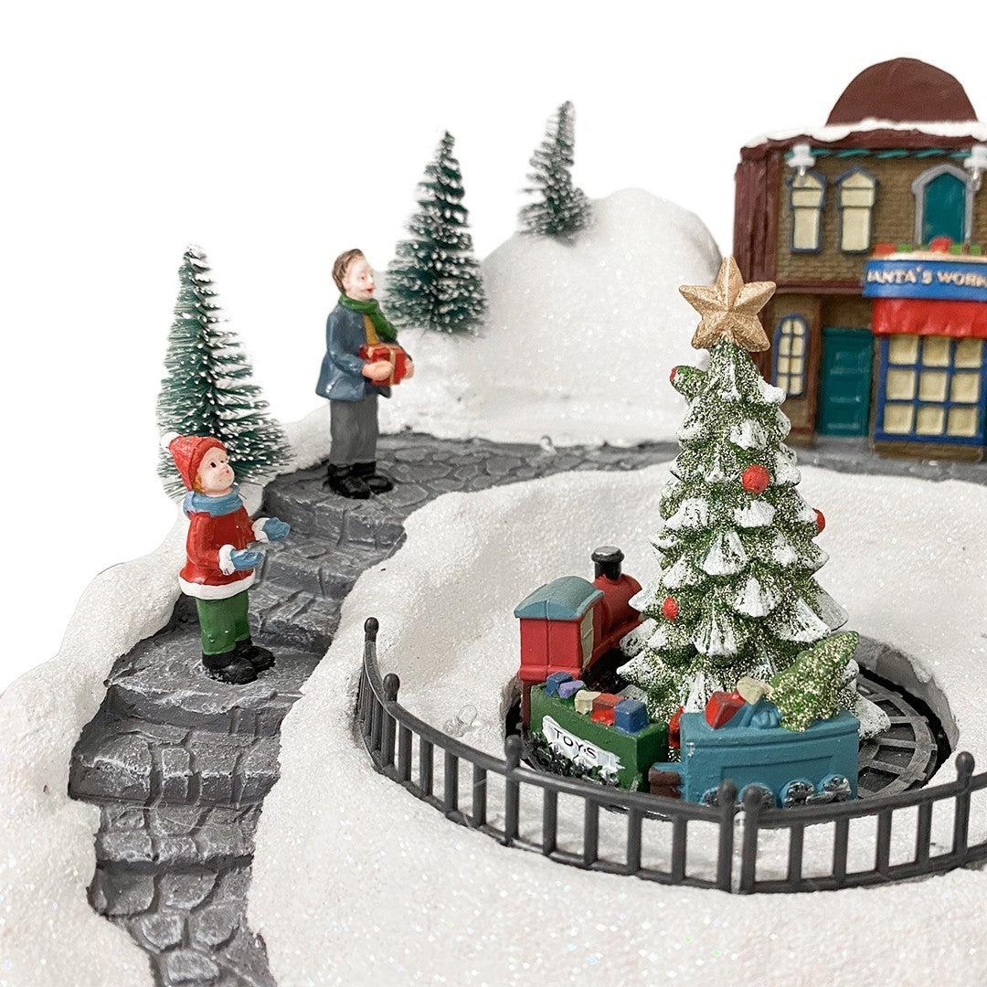 361039 Carousel Christmas Village Snow, Lights, Sounds and Movement 37x21x27