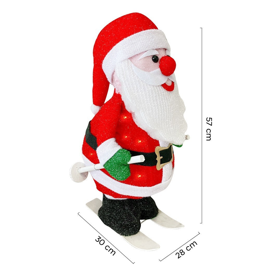 401001 Père Noël avec lumières de ski et mouvement Décoration de Noël 20X30X61cm