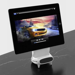 Le chargeur à induction sans fil amplifie le son pour les smartphones